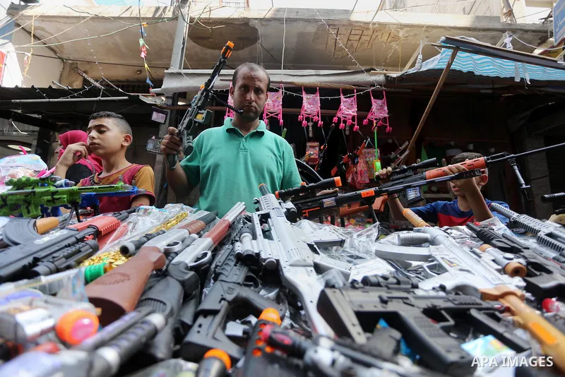 Palestinians shop at a market ahead of the Eid al-Fitr holiday, in Gaza city, on July 4, 2016. Eid al-Fitr marks the end of Muslim's holy fasting month of Ramadan when faithfuls abstain from eating, drinking, smoking and...