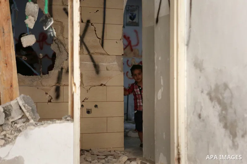 Palestinians inspect the damaged house of Issa Assaf, which was demolished by the Israeli army, in the West Bank refugee camp of Qalandia, at the outskirts of Ramallah, Monday, July 4, 2016. The Israeli army demolished t...
