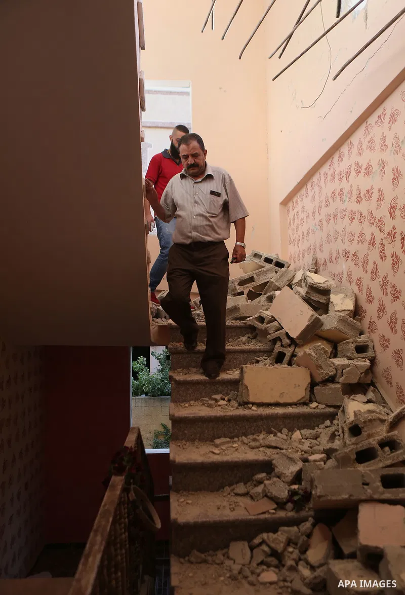 Palestinians inspect the damaged house of Anan Abu Habsa, which was demolished by the Israeli army, in the West Bank refugee camp of Qalandia, at the outskirts of Ramallah, Monday, July 4, 2016. The Israeli army demolish...