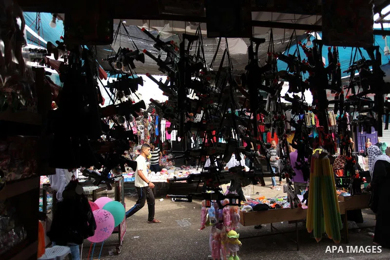 Palestinians shop at a market ahead of the Eid al-Fitr holiday, in Nuseirat refugee camp in the central Gaza Strip, on July 4, 2016. Eid al-Fitr marks the end of Muslim's holy fasting month of Ramadan when faithfuls abst...