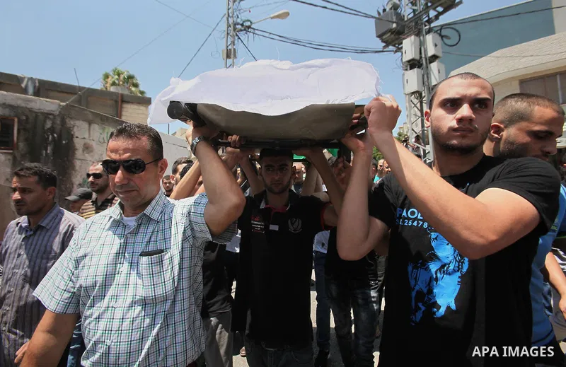 Mourners carry the body of Rayyan Shreem"3 years", a Palestinian child who was killed in the Istanbul airport attack blamed on the Islamic State (IS) group on June 28, during his funeral in the West Bank town of Qalqilya...