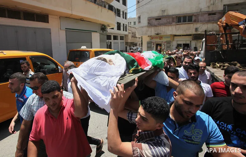 Mourners carry the body of Rayyan Shreem"3 years", a Palestinian child who was killed in the Istanbul airport attack blamed on the Islamic State (IS) group on June 28, during his funeral in the West Bank town of Qalqilya...