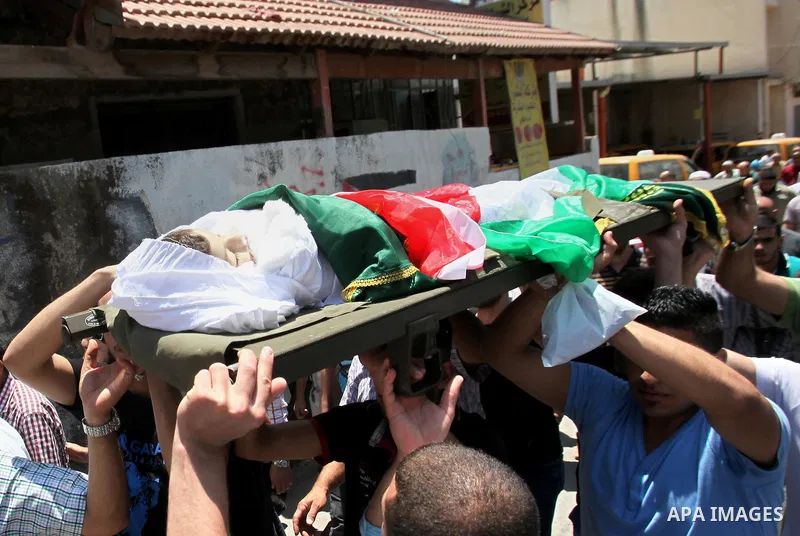 Mourners carry the body of Rayyan Shreem"3 years", a Palestinian child who was killed in the Istanbul airport attack blamed on the Islamic State (IS) group on June 28, during his funeral in the West Bank town of Qalqilya...