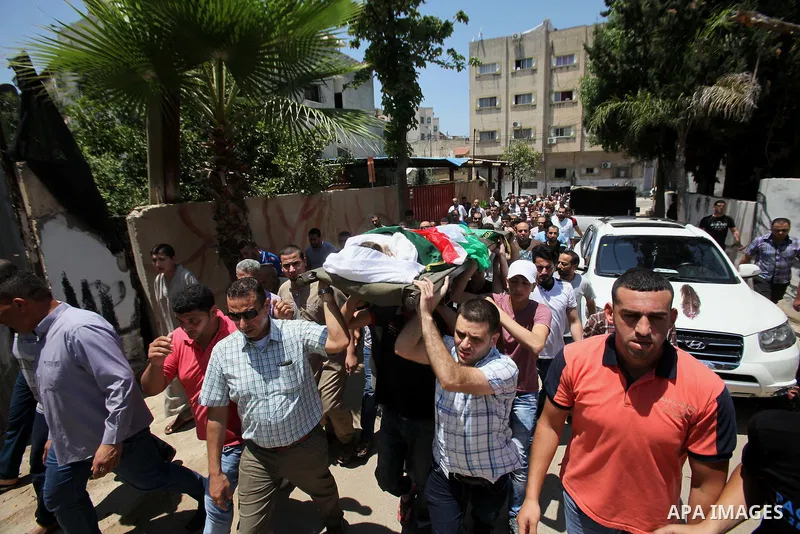 Mourners carry the body of Rayyan Shreem"3 years", a Palestinian child who was killed in the Istanbul airport attack blamed on the Islamic State (IS) group on June 28, during his funeral in the West Bank town of Qalqilya...