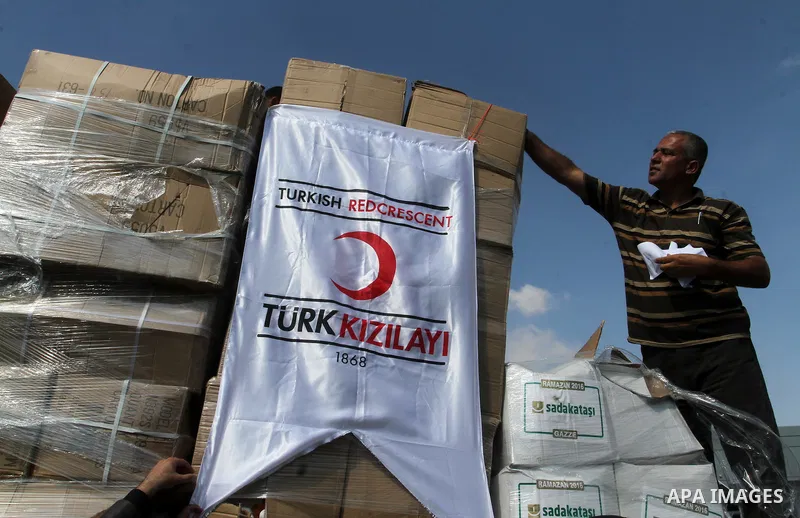 Palestinians check Turkish aid shipments upon arrival in the Gaza Strip at Kerem Shalom crossing between Israel and southern Gaza Strip July 4, 2016. A Turkish ship carrying aid for Gaza arrived in Israel on July 3, a we...