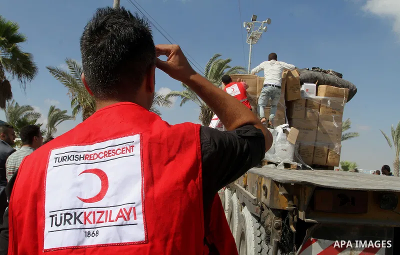 Palestinians check Turkish aid shipments upon arrival in the Gaza Strip at Kerem Shalom crossing between Israel and southern Gaza Strip July 4, 2016. A Turkish ship carrying aid for Gaza arrived in Israel on July 3, a we...