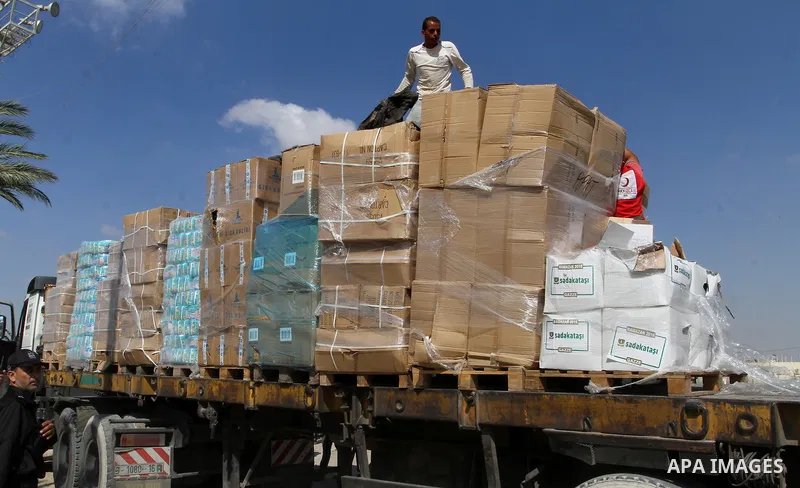 Palestinians check Turkish aid shipments upon arrival in the Gaza Strip at Kerem Shalom crossing between Israel and southern Gaza Strip July 4, 2016. A Turkish ship carrying aid for Gaza arrived in Israel on July 3, a we...