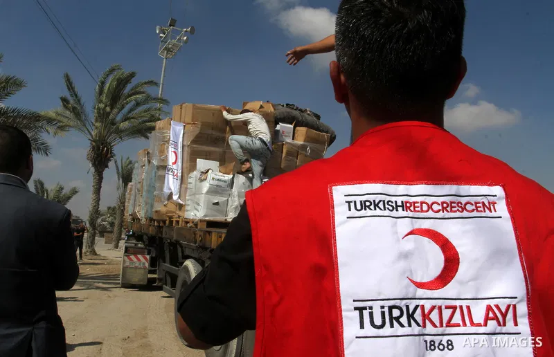 Palestinians check Turkish aid shipments upon arrival in the Gaza Strip at Kerem Shalom crossing between Israel and southern Gaza Strip July 4, 2016. A Turkish ship carrying aid for Gaza arrived in Israel on July 3, a we...