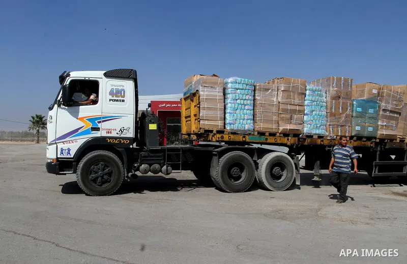 A truck loaded with aid parcels provided by Turkey is parked at Kerem Shalom crossing between Israel and southern Gaza Strip July 4, 2016. A Turkish ship carrying aid for Gaza arrived in Israel on July 3, a week after th...