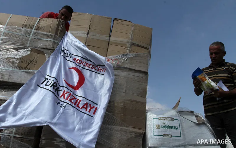 Palestinians check Turkish aid shipments upon arrival in the Gaza Strip at Kerem Shalom crossing between Israel and southern Gaza Strip July 4, 2016. A Turkish ship carrying aid for Gaza arrived in Israel on July 3, a we...