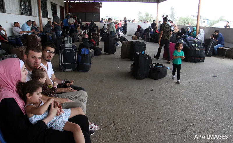 Palestinians wait for a travel permit to cross into Egypt through the Rafah border crossing after it was opened by Egyptian authorities for five days, in the southern Gaza Strip July 04, 2016. Photo by Abed Rahim Khatib