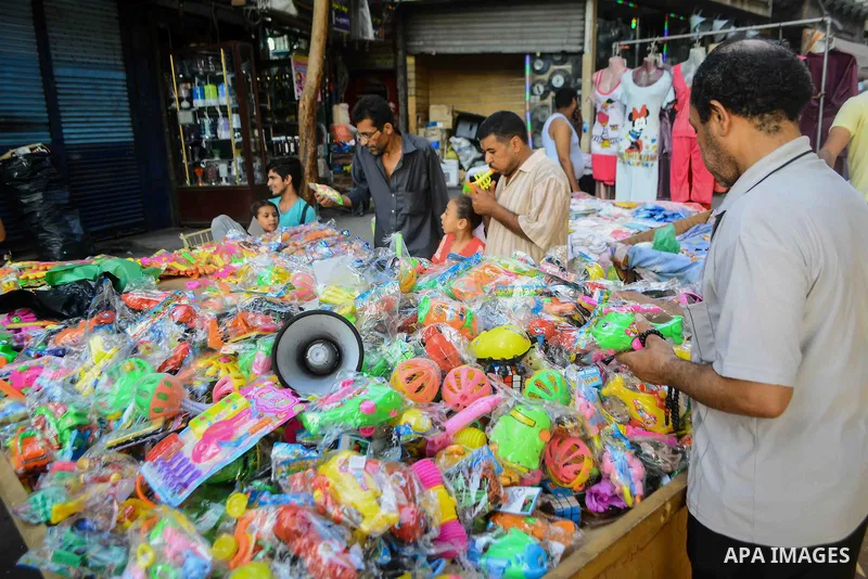Egyptians shop at market ahead of the Eid al-Fitr holiday in Cairo, Egypt, on July 04, 2016, as Muslims the world over prepare to celebrate Eid al-Fitr, starting with the with the sighting of the new moon, to mark the en...