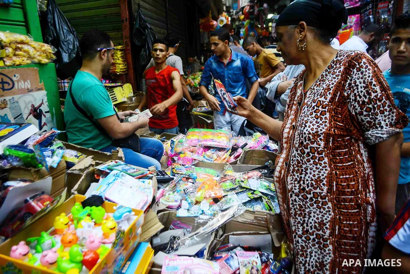 Egyptians shop at market ahead of the Eid al-Fitr holiday in Cairo, Egypt, on July 04, 2016, as Muslims the world over prepare to celebrate Eid al-Fitr, starting with the with the sighting of the new moon, to mark the en...