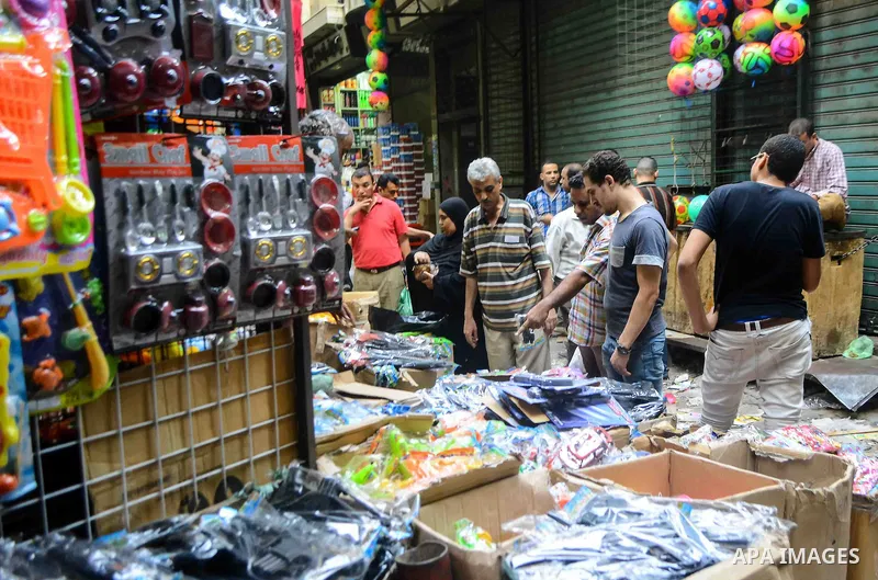 Egyptians shop at market ahead of the Eid al-Fitr holiday in Cairo, Egypt, on July 04, 2016, as Muslims the world over prepare to celebrate Eid al-Fitr, starting with the with the sighting of the new moon, to mark the en...