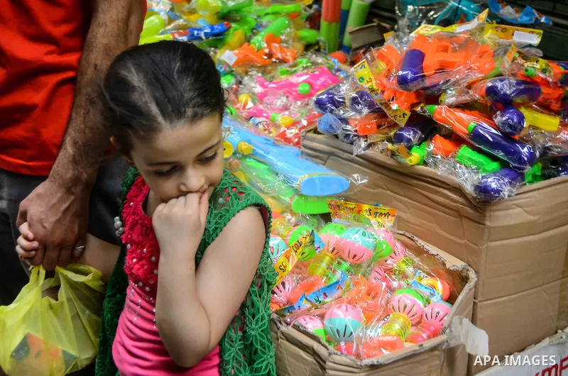 Egyptians shop at market ahead of the Eid al-Fitr holiday in Cairo, Egypt, on July 04, 2016, as Muslims the world over prepare to celebrate Eid al-Fitr, starting with the with the sighting of the new moon, to mark the en...