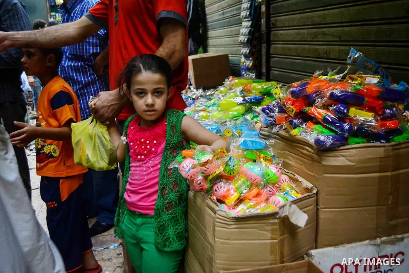 Egyptians shop at market ahead of the Eid al-Fitr holiday in Cairo, Egypt, on July 04, 2016, as Muslims the world over prepare to celebrate Eid al-Fitr, starting with the with the sighting of the new moon, to mark the en...