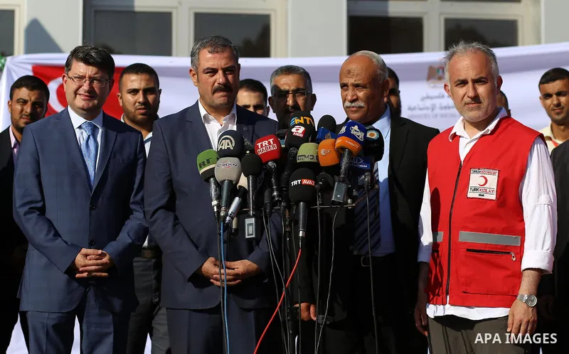 President of Turkish Red Crescent Kerem Kinik speaks during a press conference after humanitarian aid parcels provided by Turkey entered the southern Gaza Strip from Israel through the Kerem Shalom crossing July 4, 2016....