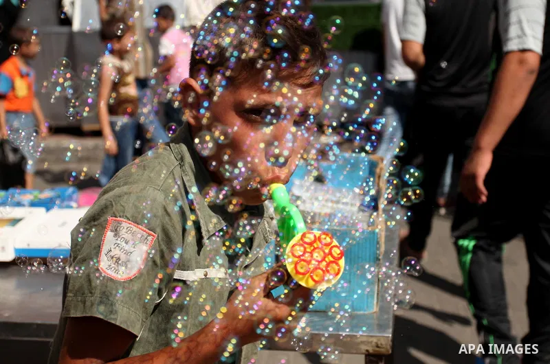 Palestinians shop at market ahead of the Eid al-Fitr holiday in Gaza city, on July 05, 2016, as Muslims the world over prepare to celebrate Eid al-Fitr, starting with the with the sighting of the new moon, to mark the en...