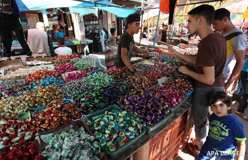 Palestinians shop at market ahead of the Eid al-Fitr holiday in Gaza city, on July 05, 2016, as Muslims the world over prepare to celebrate Eid al-Fitr, starting with the with the sighting of the new moon, to mark the en...