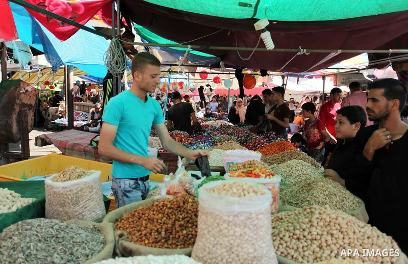 Palestinians shop at market ahead of the Eid al-Fitr holiday in Gaza city, on July 05, 2016, as Muslims the world over prepare to celebrate Eid al-Fitr, starting with the with the sighting of the new moon, to mark the en...