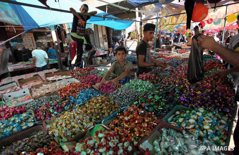 Palestinians shop at market ahead of the Eid al-Fitr holiday in Gaza city, on July 05, 2016, as Muslims the world over prepare to celebrate Eid al-Fitr, starting with the with the sighting of the new moon, to mark the en...