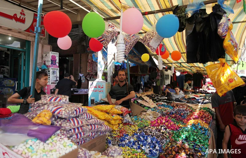 Palestinians shop at market ahead of the Eid al-Fitr holiday in Gaza city, on July 05, 2016, as Muslims the world over prepare to celebrate Eid al-Fitr, starting with the with the sighting of the new moon, to mark the en...