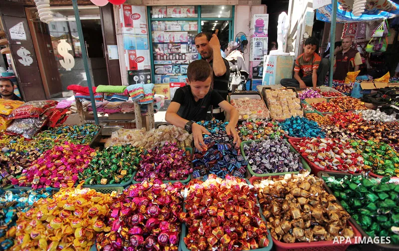 Palestinians shop at market ahead of the Eid al-Fitr holiday in Gaza city, on July 05, 2016, as Muslims the world over prepare to celebrate Eid al-Fitr, starting with the with the sighting of the new moon, to mark the en...