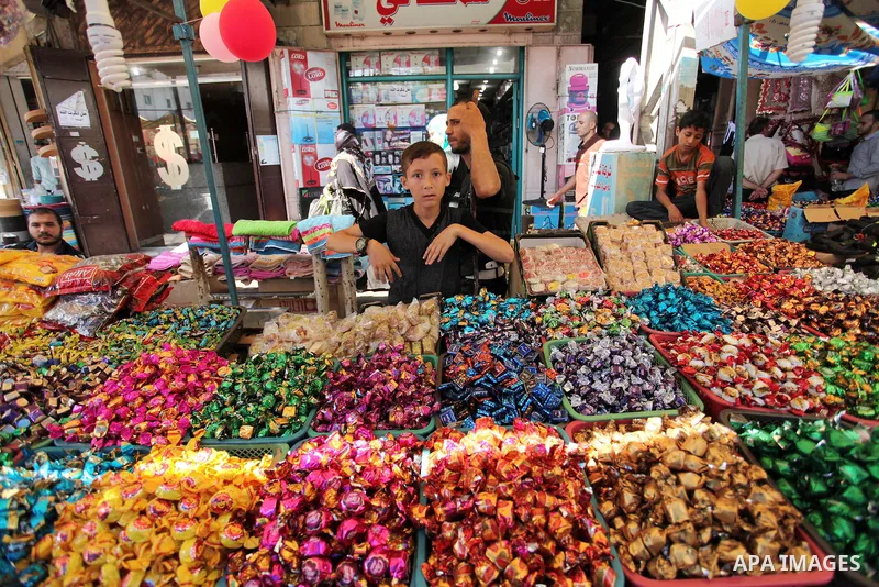 Palestinians shop at market ahead of the Eid al-Fitr holiday in Gaza city, on July 05, 2016, as Muslims the world over prepare to celebrate Eid al-Fitr, starting with the with the sighting of the new moon, to mark the en...