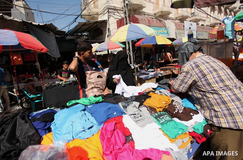 Palestinians shop at market ahead of the Eid al-Fitr holiday in Gaza city, on July 05, 2016, as Muslims the world over prepare to celebrate Eid al-Fitr, starting with the with the sighting of the new moon, to mark the en...