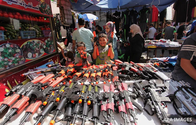 Palestinians shop at market ahead of the Eid al-Fitr holiday in Gaza city, on July 05, 2016, as Muslims the world over prepare to celebrate Eid al-Fitr, starting with the with the sighting of the new moon, to mark the en...