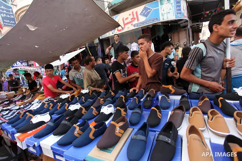Palestinians shop at market ahead of the Eid al-Fitr holiday in Gaza city, on July 05, 2016, as Muslims the world over prepare to celebrate Eid al-Fitr, starting with the with the sighting of the new moon, to mark the en...