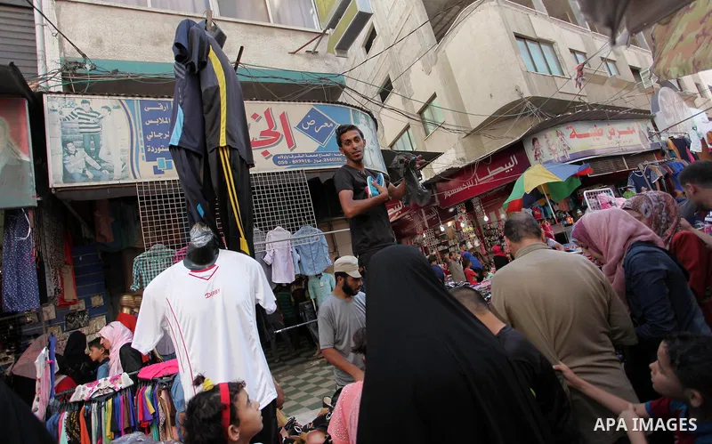Palestinians shop at market ahead of the Eid al-Fitr holiday in Gaza city, on July 05, 2016, as Muslims the world over prepare to celebrate Eid al-Fitr, starting with the with the sighting of the new moon, to mark the en...