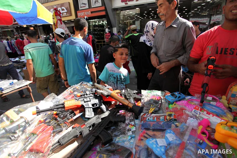 Palestinians shop at market ahead of the Eid al-Fitr holiday in Gaza city, on July 05, 2016, as Muslims the world over prepare to celebrate Eid al-Fitr, starting with the with the sighting of the new moon, to mark the en...