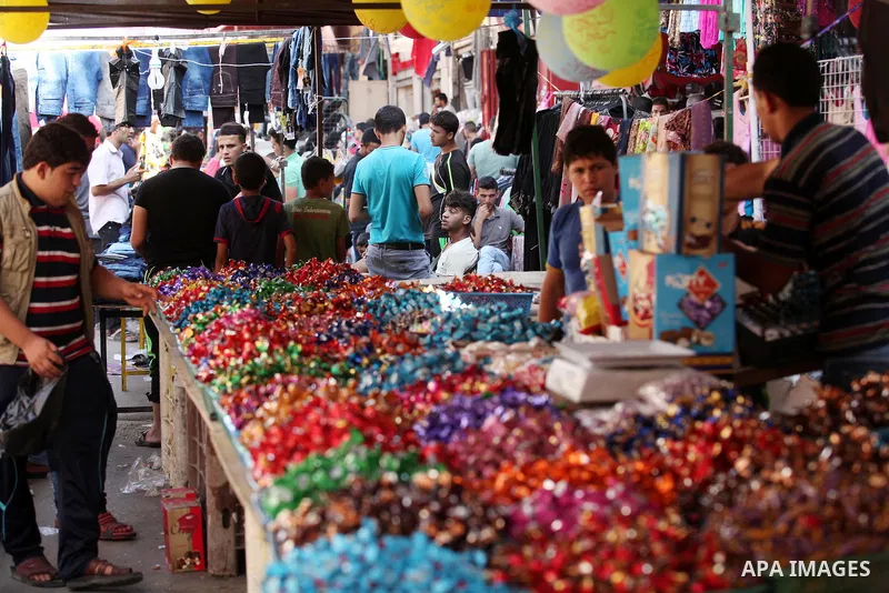 Palestinians shop at market ahead of the Eid al-Fitr holiday in Gaza city, on July 05, 2016, as Muslims the world over prepare to celebrate Eid al-Fitr, starting with the with the sighting of the new moon, to mark the en...