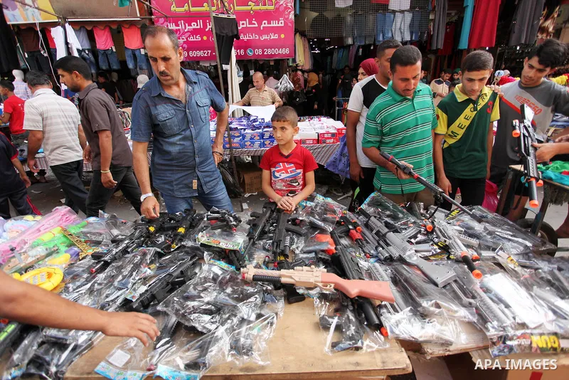 Palestinians shop at market ahead of the Eid al-Fitr holiday in Gaza city, on July 05, 2016, as Muslims the world over prepare to celebrate Eid al-Fitr, starting with the with the sighting of the new moon, to mark the en...