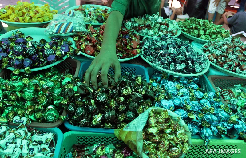 Palestinians shop at market ahead of the Eid al-Fitr holiday in Rafah in the southern Gaza strip, on July 05, 2016, as Muslims the world over prepare to celebrate Eid al-Fitr, starting with the with the sighting of the n...