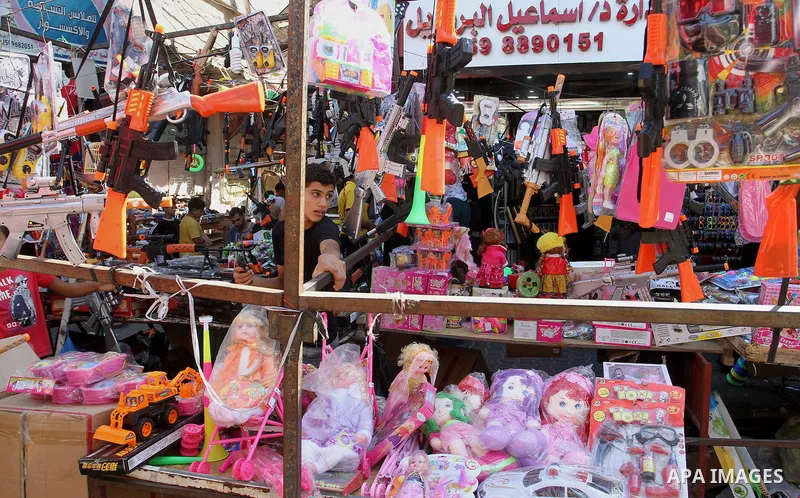 Palestinians shop at market ahead of the Eid al-Fitr holiday in Rafah in the southern Gaza strip, on July 05, 2016, as Muslims the world over prepare to celebrate Eid al-Fitr, starting with the with the sighting of the n...