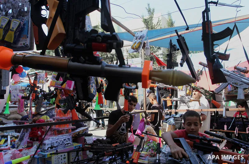Palestinians shop at market ahead of the Eid al-Fitr holiday in Rafah in the southern Gaza strip, on July 05, 2016, as Muslims the world over prepare to celebrate Eid al-Fitr, starting with the with the sighting of the n...