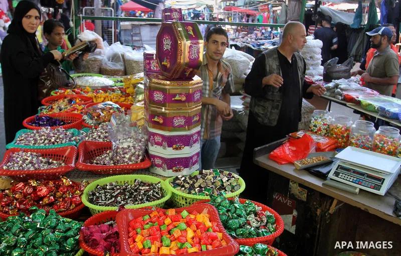 Palestinians shop at market ahead of the Eid al-Fitr holiday in Rafah in the southern Gaza strip, on July 05, 2016, as Muslims the world over prepare to celebrate Eid al-Fitr, starting with the with the sighting of the n...
