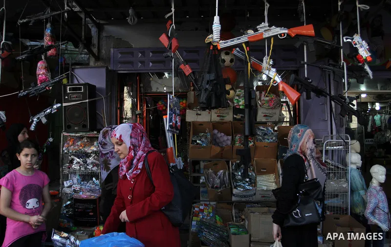 Palestinians shop at market ahead of the Eid al-Fitr holiday in Rafah in the southern Gaza strip, on July 05, 2016, as Muslims the world over prepare to celebrate Eid al-Fitr, starting with the with the sighting of the n...