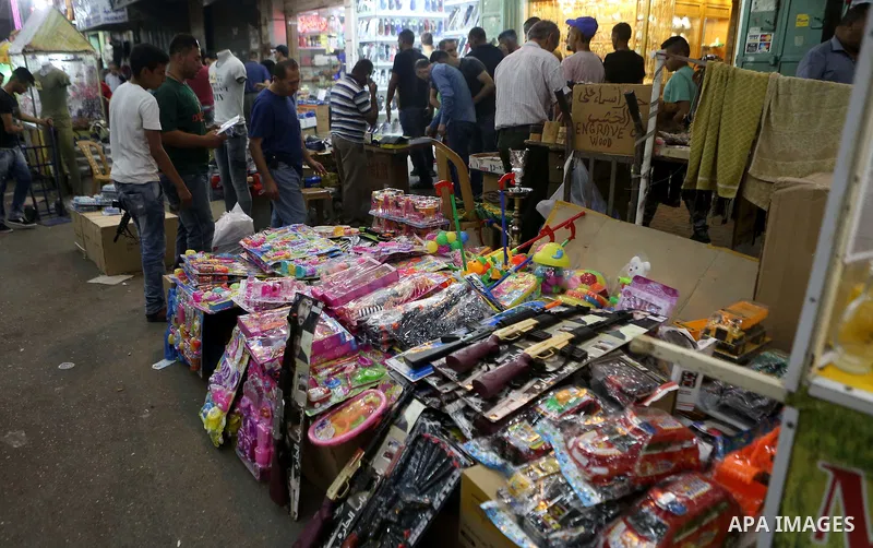 Palestinians shop at market ahead of the Eid al-Fitr holiday in the West Bank city of Ramallah, on July 05, 2016, as Muslims the world over prepare to celebrate Eid al-Fitr, starting with the with the sighting of the new...