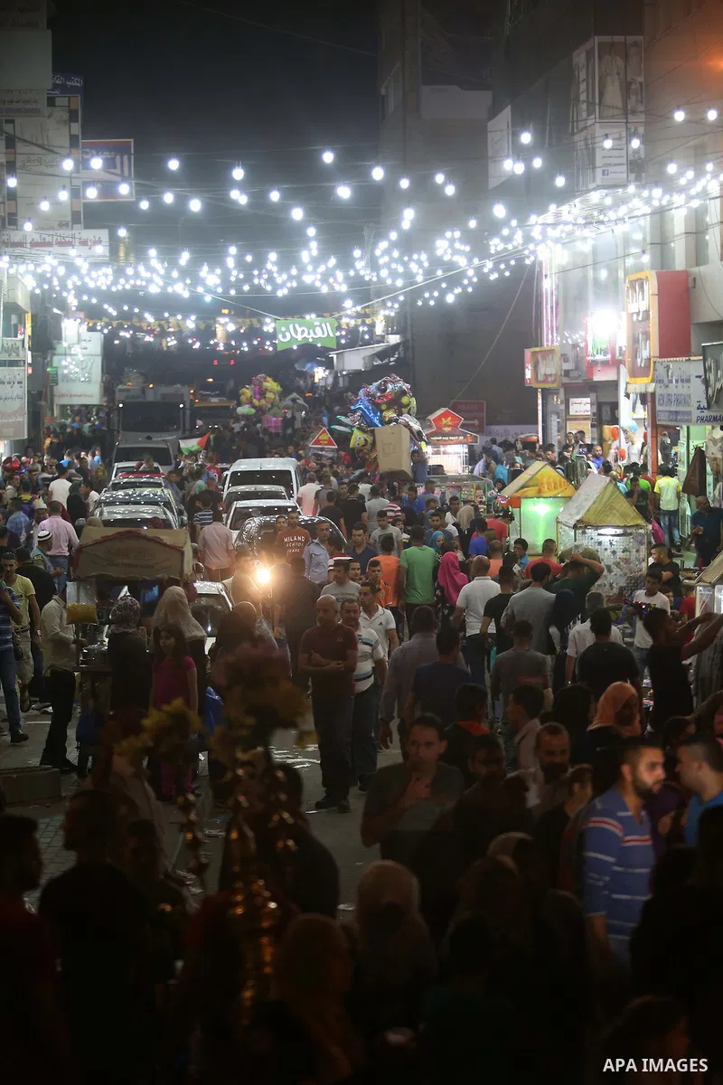 Palestinians shop at market ahead of the Eid al-Fitr holiday in the West Bank city of Ramallah, on July 05, 2016, as Muslims the world over prepare to celebrate Eid al-Fitr, starting with the with the sighting of the new...