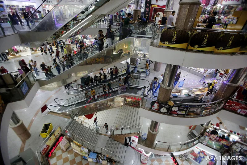 Palestinians shop at market ahead of the Eid al-Fitr holiday in the West Bank city of Hebron, on July 05, 2016, as Muslims the world over prepare to celebrate Eid al-Fitr, starting with the with the sighting of the new m...