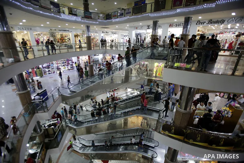 Palestinians shop at market ahead of the Eid al-Fitr holiday in the West Bank city of Hebron, on July 05, 2016, as Muslims the world over prepare to celebrate Eid al-Fitr, starting with the with the sighting of the new m...
