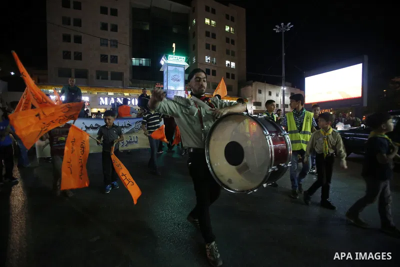 Palestinian scouts play music to celebrate for Eid al-Fitr holiday in the West Bank city of Hebron, on July 05, 2016, as Muslims the world over prepare to celebrate Eid al-Fitr, starting with the with the sighting of the...