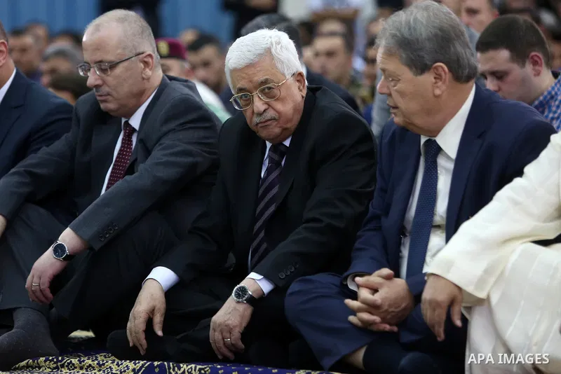 Palestinian President Mahmoud Abbas attends the morning prayers for Eid al-Fitr celebrations, which marks the end of the holy fasting month of Ramadan, in the West Bank city of Ramallah July 6, 2016. Photo by Shadi Hatem