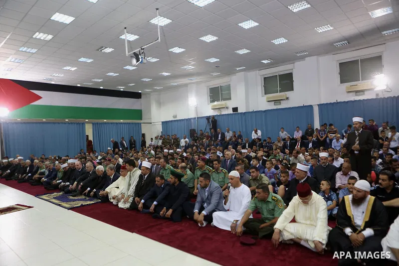 Palestinian President Mahmoud Abbas attends the morning prayers for Eid al-Fitr celebrations, which marks the end of the holy fasting month of Ramadan, in the West Bank city of Ramallah July 6, 2016. Photo by Shadi Hatem