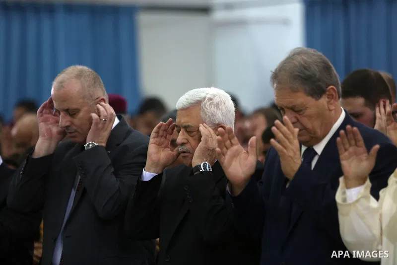 Palestinian President Mahmoud Abbas attends the morning prayers for Eid al-Fitr celebrations, which marks the end of the holy fasting month of Ramadan, in the West Bank city of Ramallah July 6, 2016. Photo by Shadi Hatem