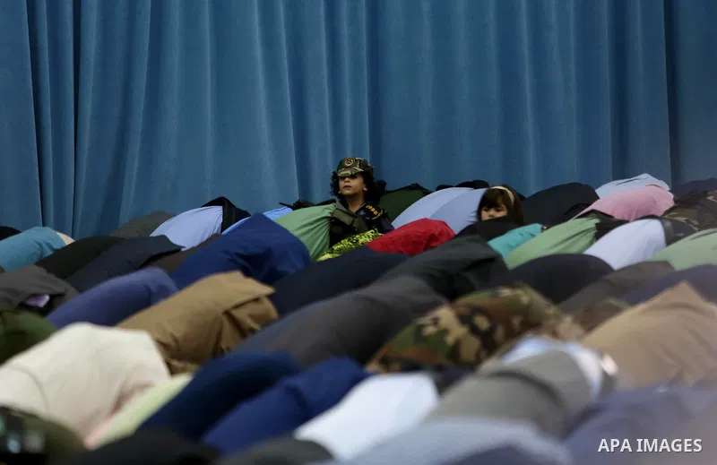 Palestinians attend the morning prayers for Eid al-Fitr celebrations, which marks the end of the holy fasting month of Ramadan, in the West Bank city of Ramallah July 6, 2016. Photo by Shadi Hatem