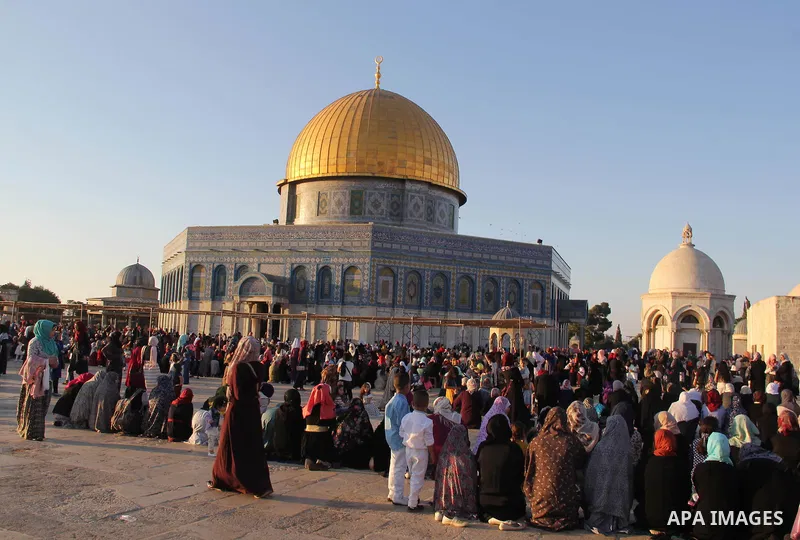 Palestinian Muslim after perform the morning Eid al-Fitr prayer near the Dome of Rock at the Al-Aqsa Mosque compound, Islam's third most holy site, in the old city of Jerusalem on July 6, 2016. Muslims worldwide celebrat...